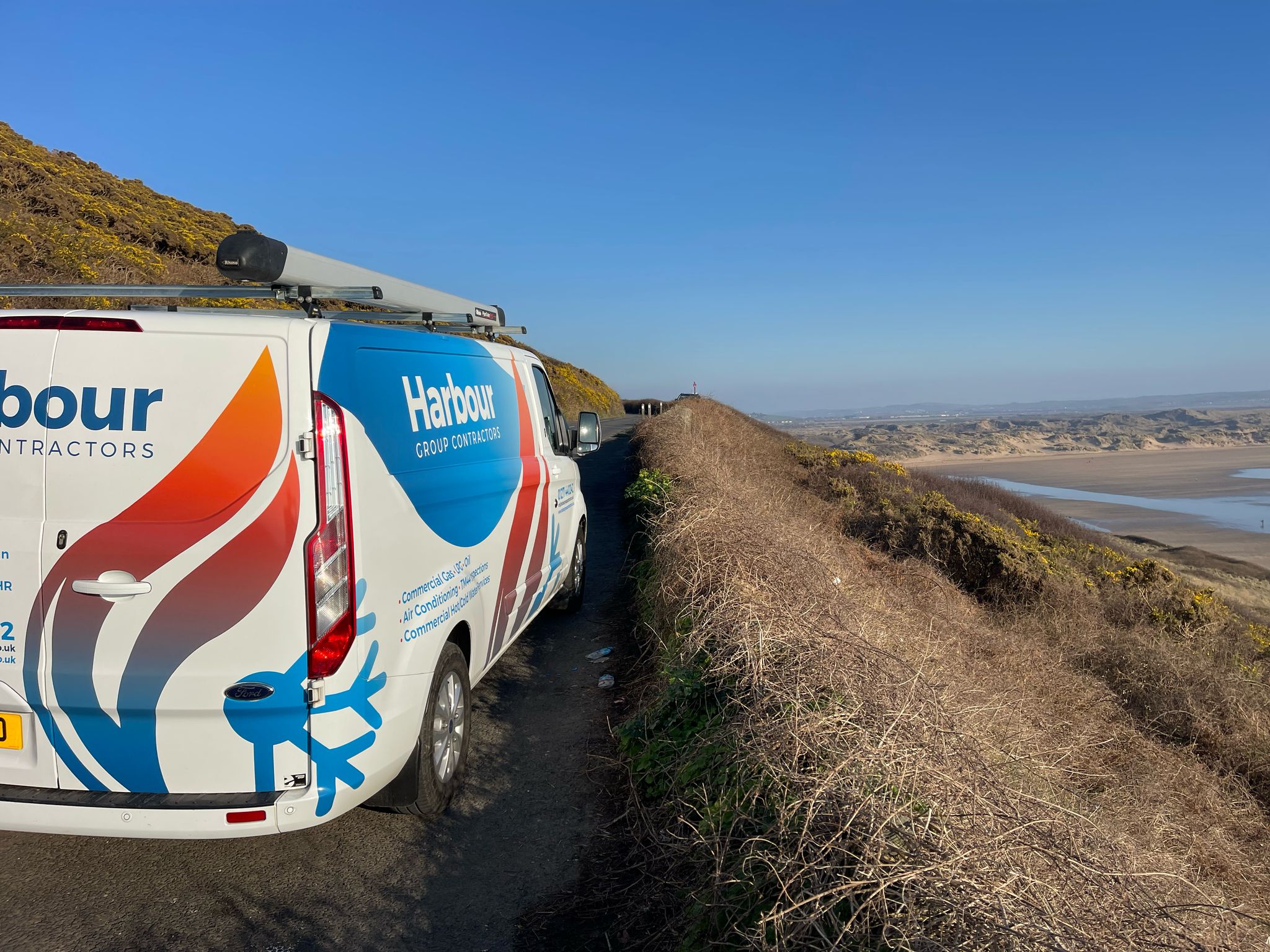 Harbour Group Contractors van parked next to Saunton, Devon, Barnstaple.